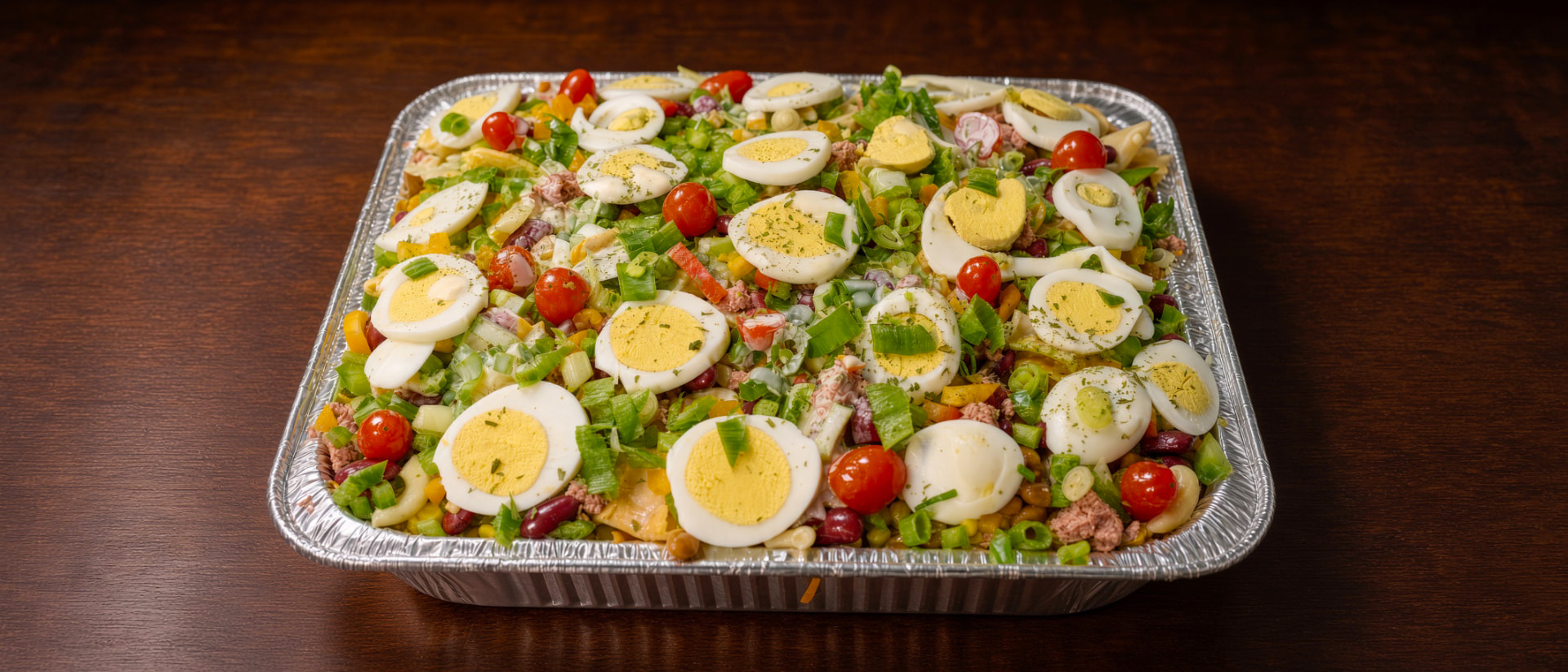 A wide Beyond Salad salad tray ready for a gathering