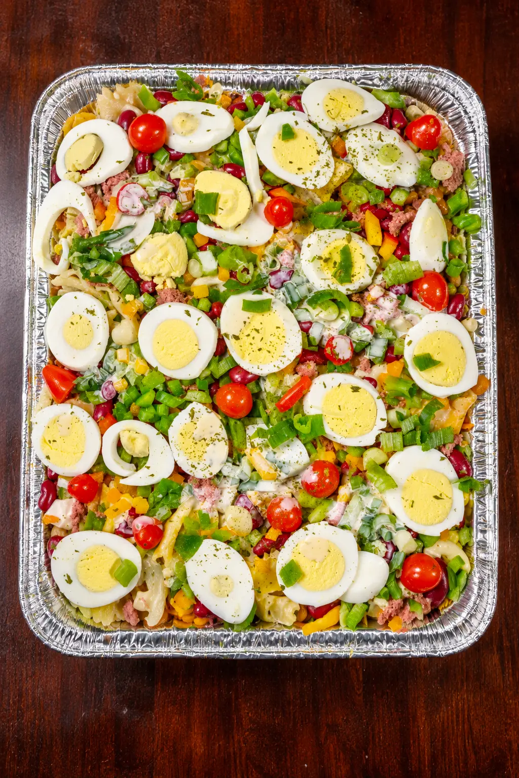 An overhead view of a full Beyond Salad vegetable salad tray