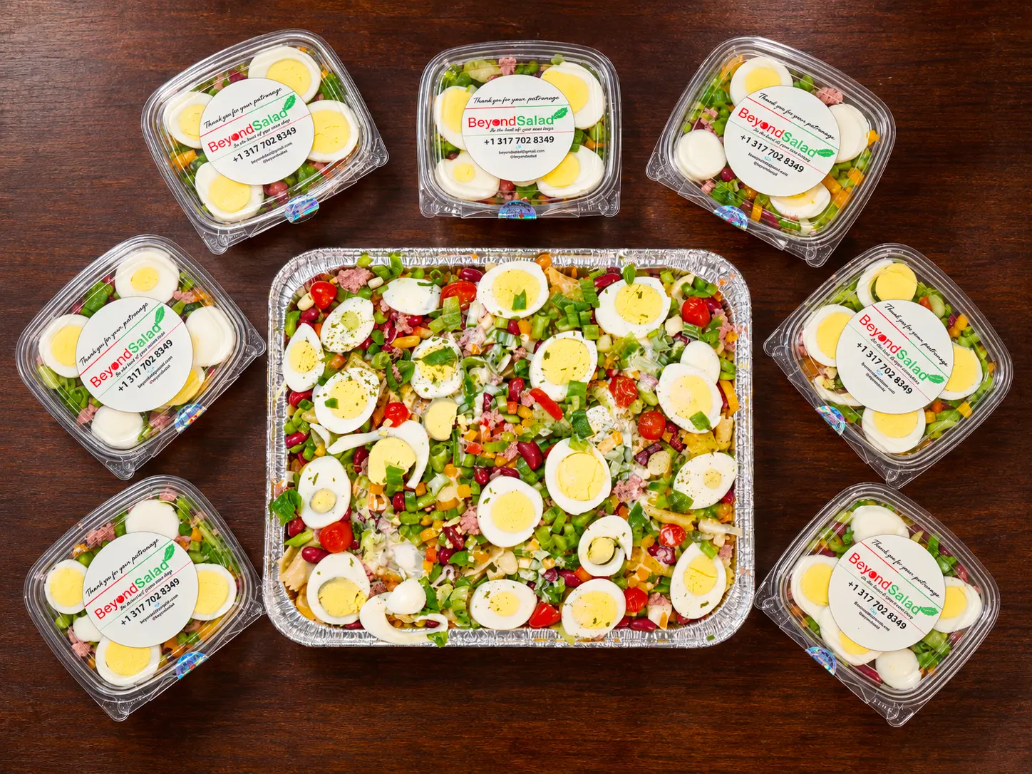 A Beyond Salad tray with branded individual salad containers